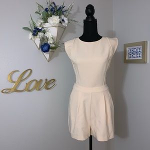 Cap sleeves Cream romper. Lace back. NWT. Size M